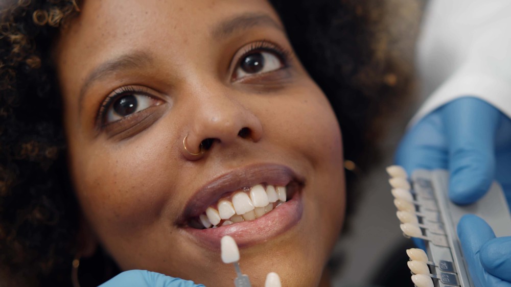 young Black woman receiving dental care
